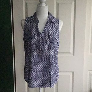 White and navy sleeveless blouse with abstract print